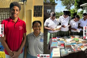 Le President de livres en liberte de jacmel pose avec la responsable de stand de Haiti Livres