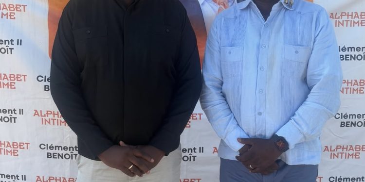 Clément II Benoît honoré aux Gonaïves : le livre comme flambeau de mémoire 1 Le Rev. Père Eric COTHIERE pose avec Dr Clément II BENOÎT
